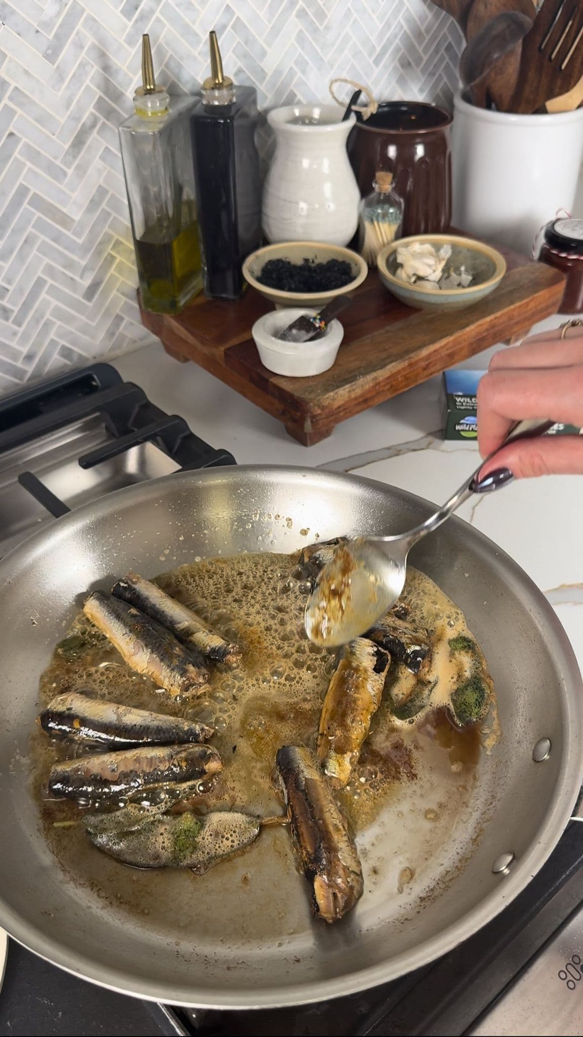 Brown butter sardine toast with whipped goat cheese, sage & fig jam